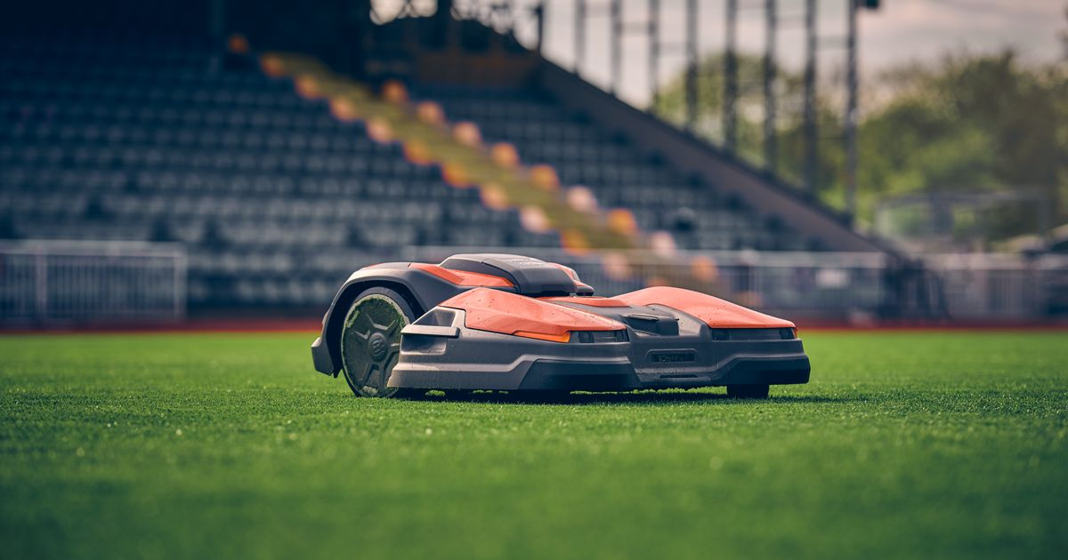 Autonomous mower on stadium turf
